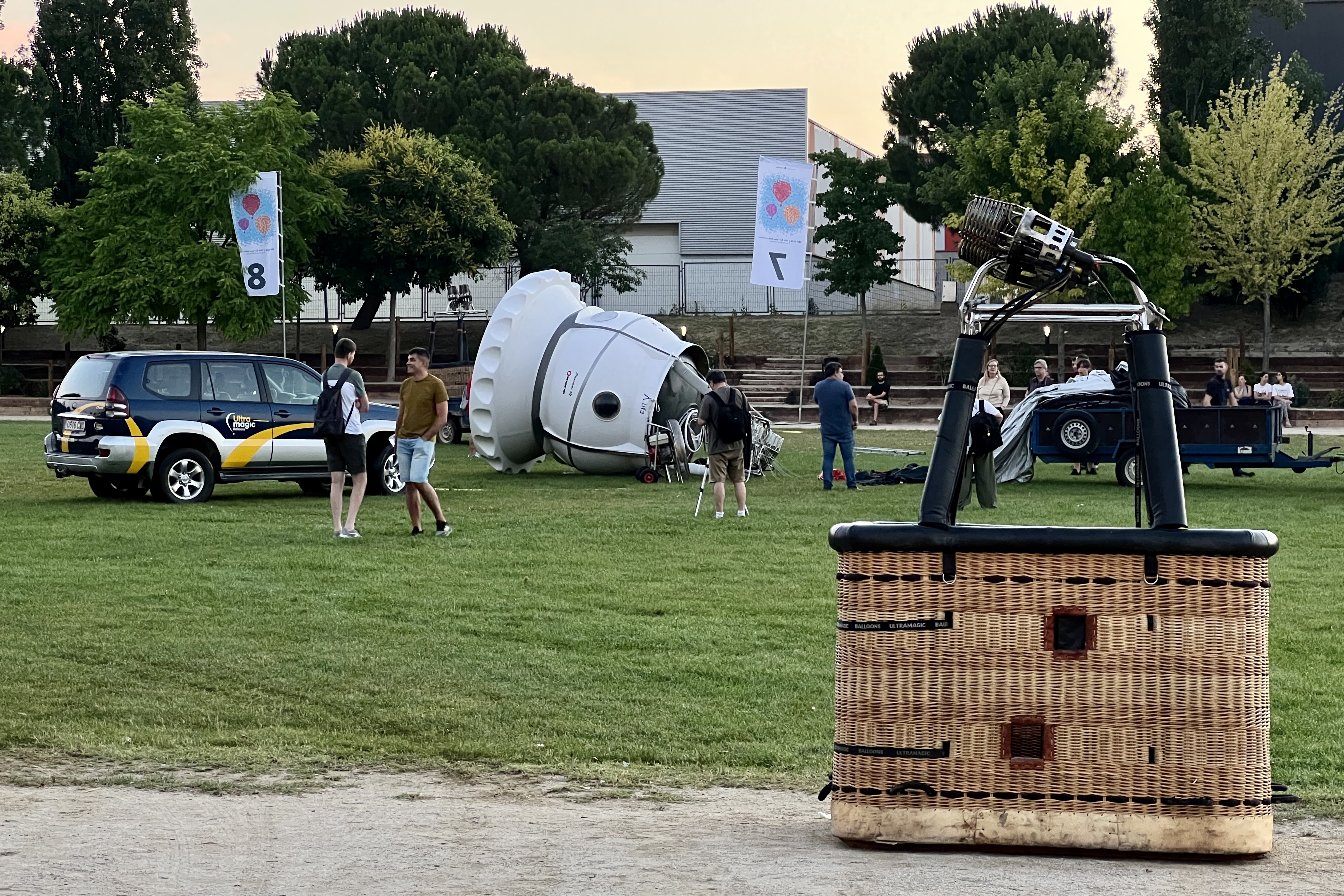 The new hot air balloon  prepared to fly at 20,000 meters height during its preparation behind a normal and traditional cabin