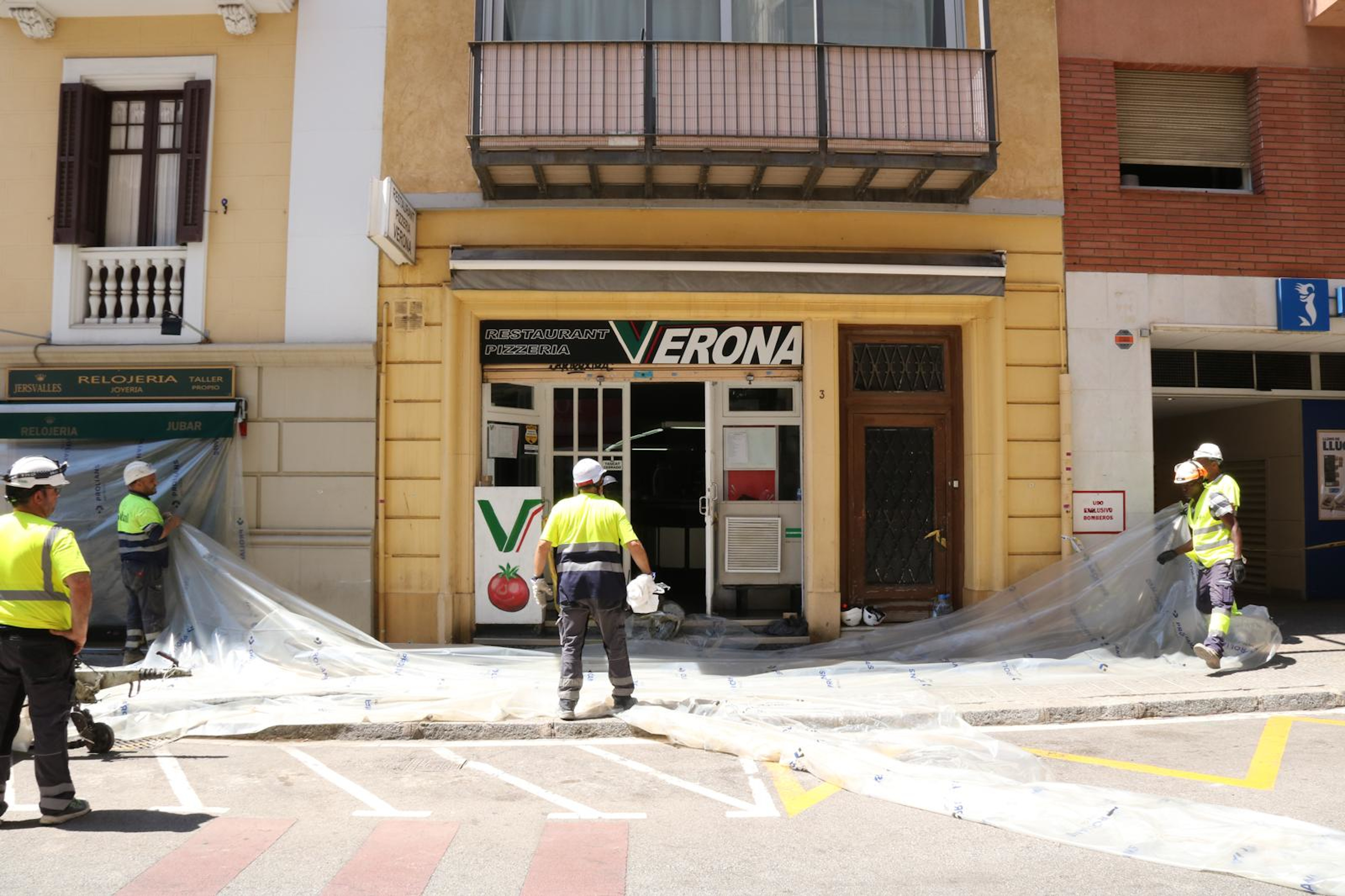 Workers at the sinkhole site