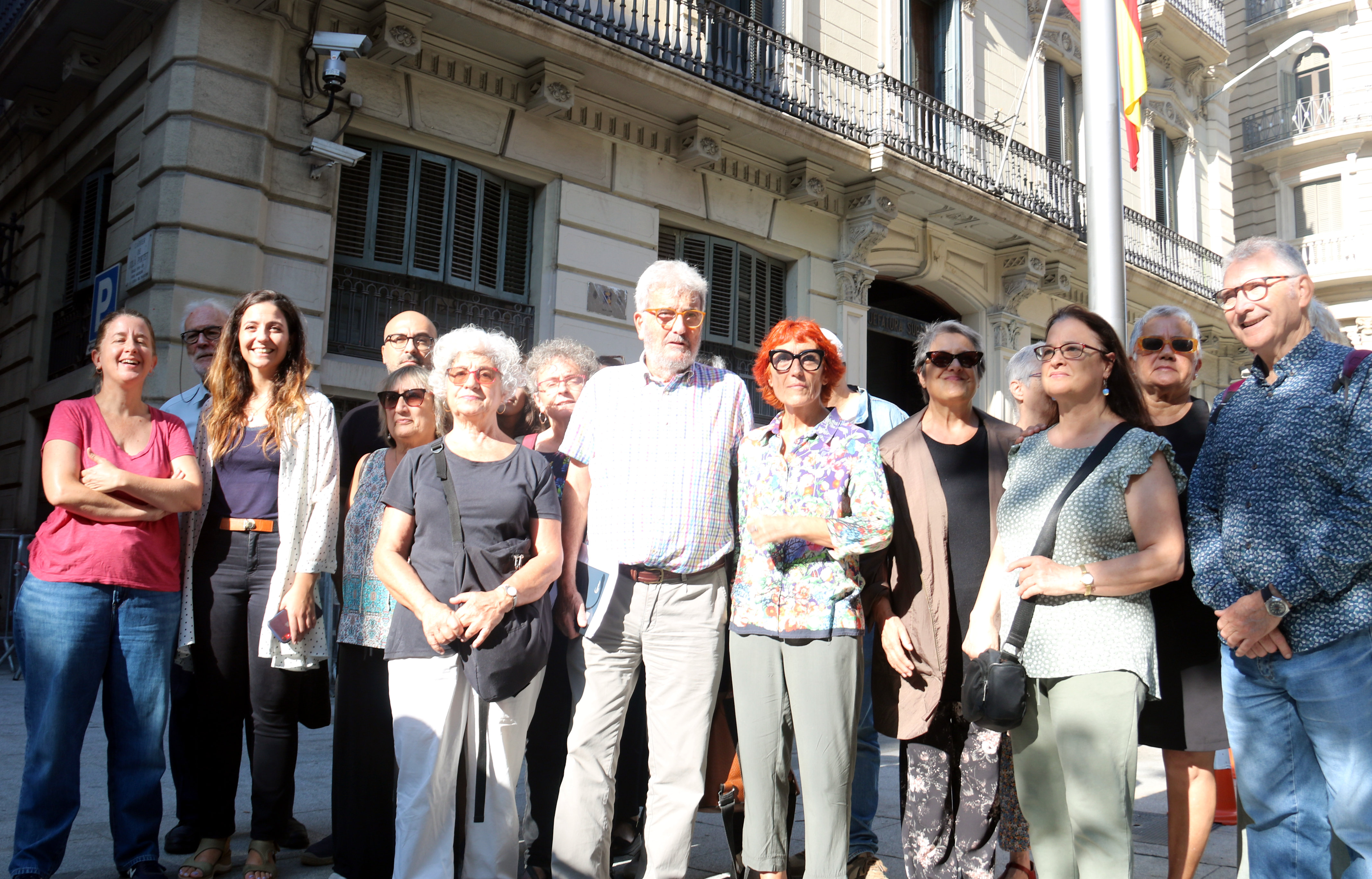 Former trade unionist Carles Vallejo photographed alongside human rights activists outside the Via Laietana police station