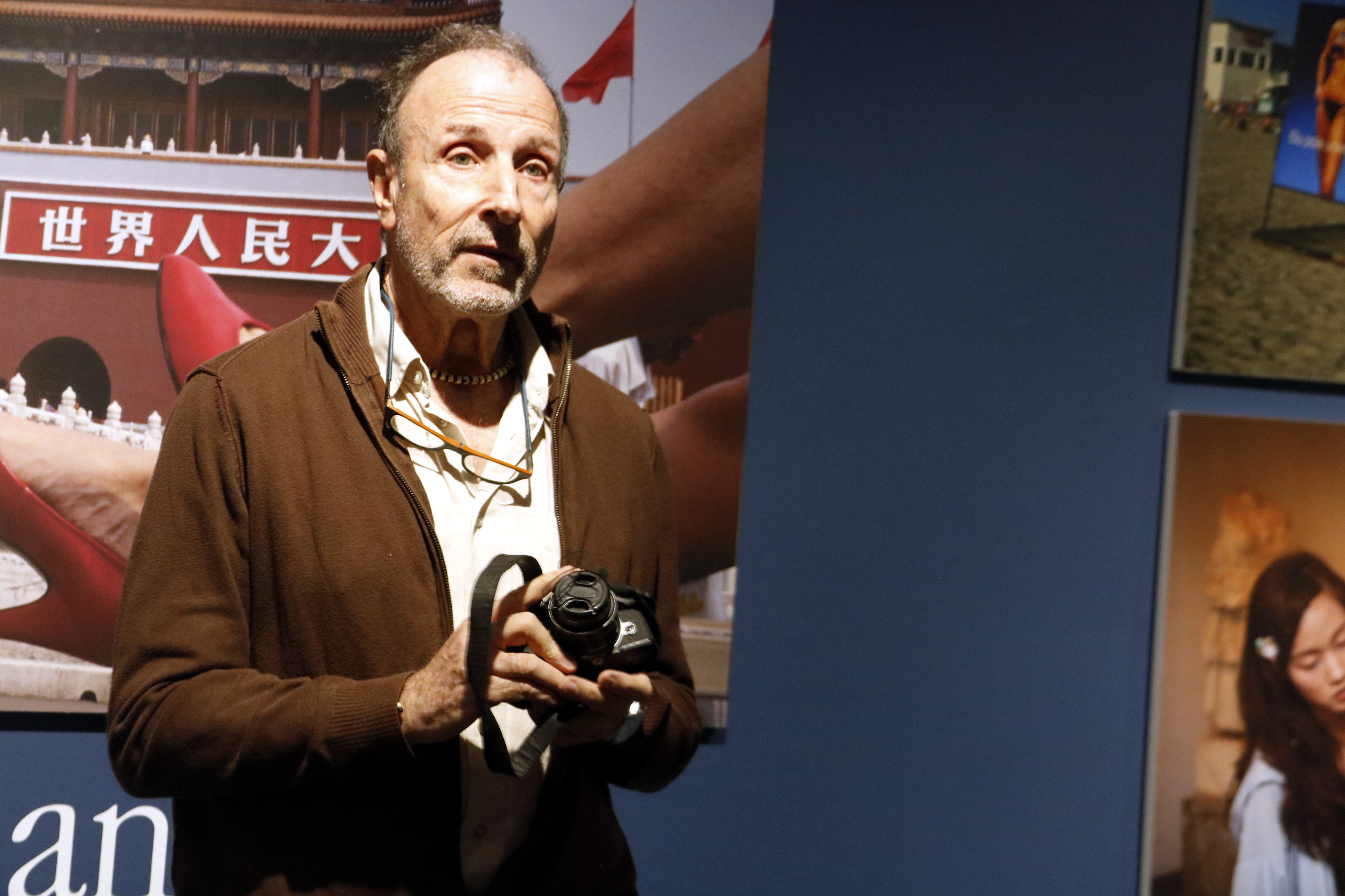 Photojournalist Tino Soriano holds a camera