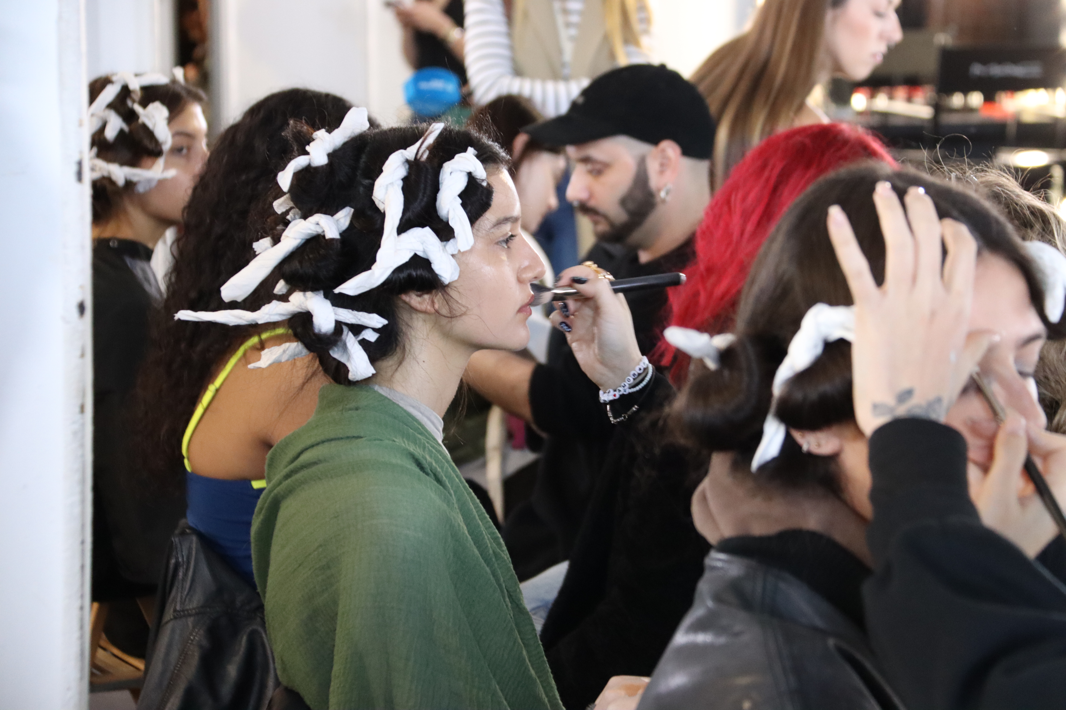 Models getting ready to parade on the 080 Barcelona Fashion catwalk on April 9, 2024