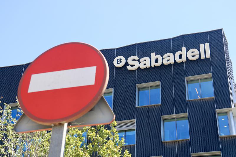 Road sign in front of Bank Sabadell HQ in Sant Cugat del Vallès