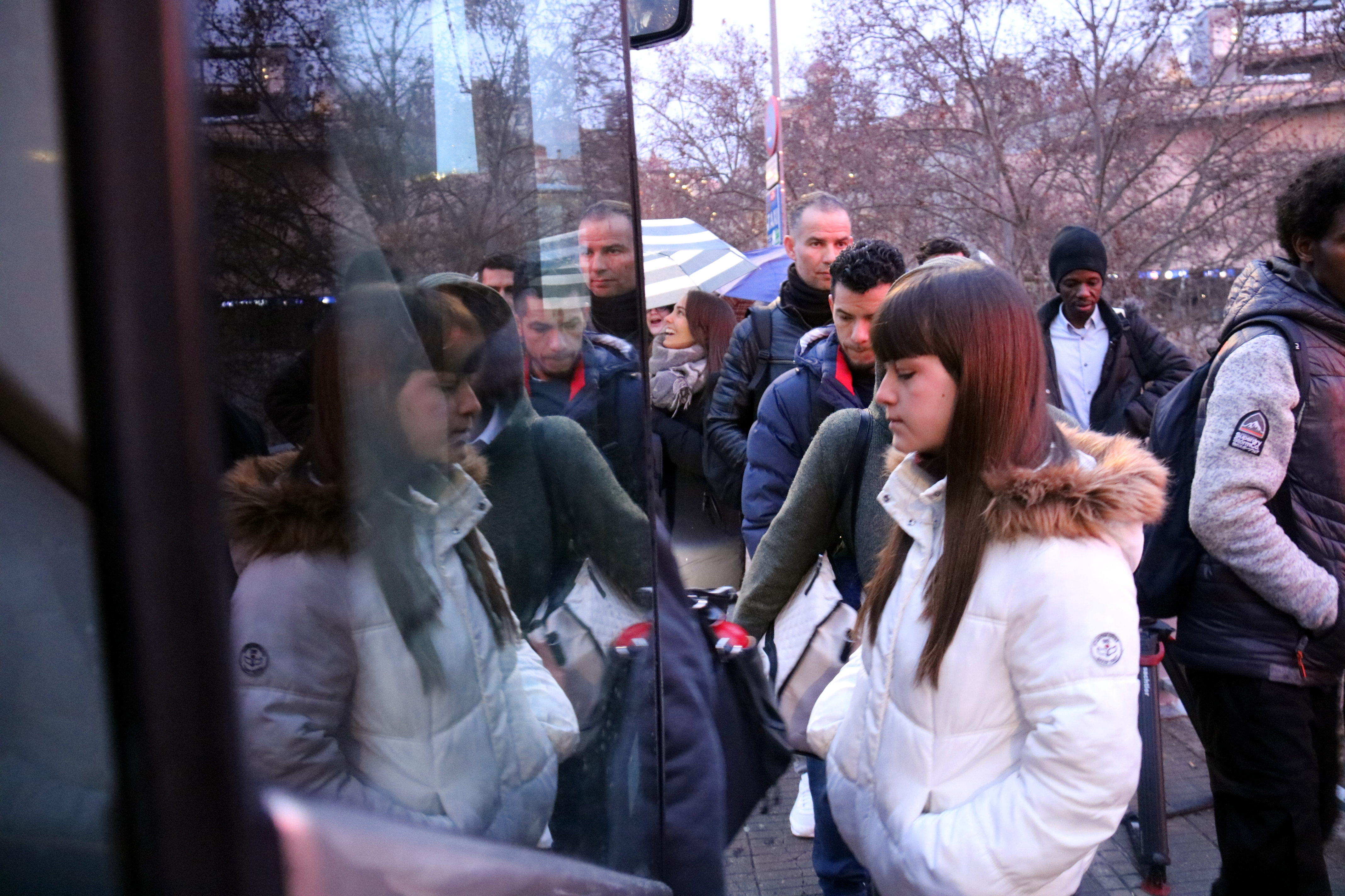 A Rodalies passenger boards a bus replacement service in Manresa