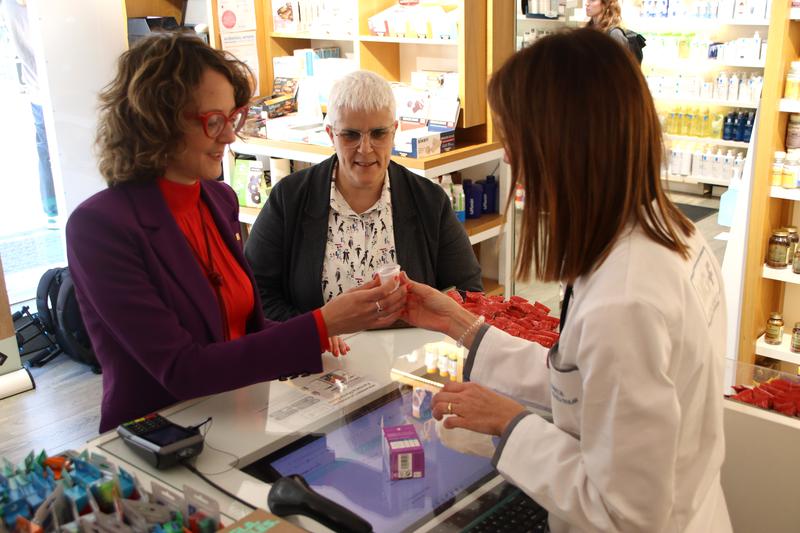 Catalan Equality Minister Tània Verge receives a menstrual cup at a pharmacy