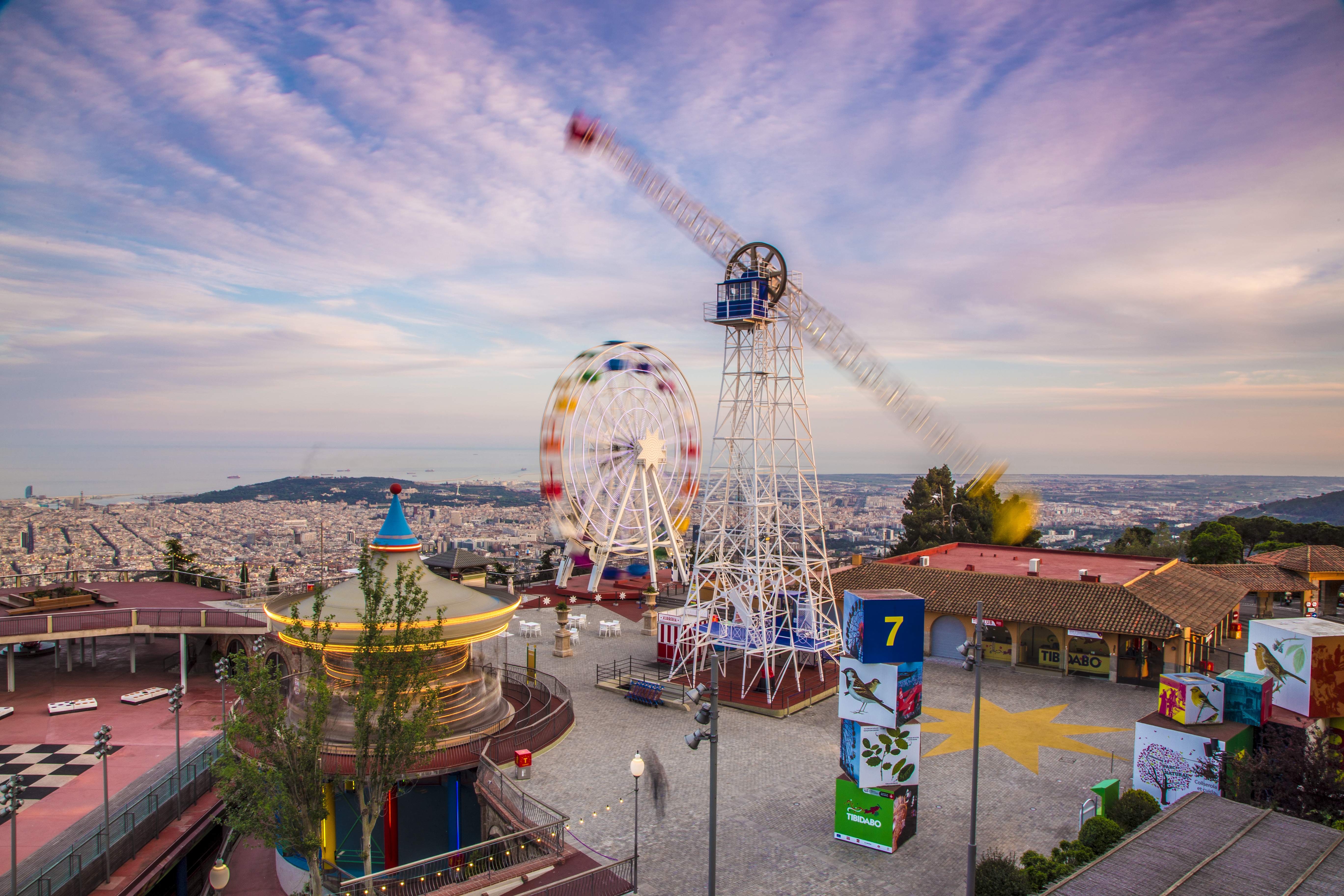 A panoramic view of the Tibidabo amusements park overlooking the city of Barcelona