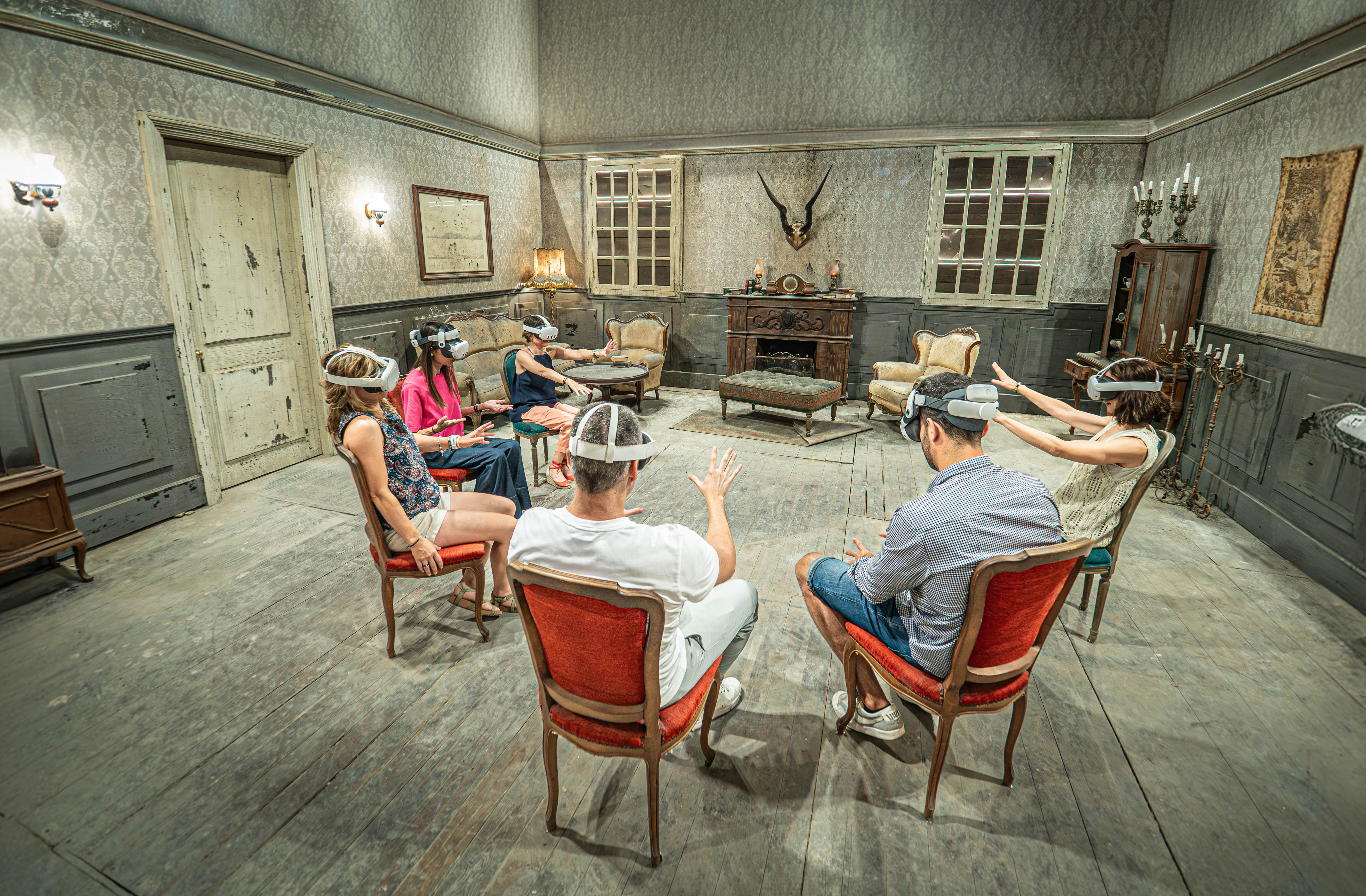 Mixed reality participants sitting down at the new PortAventura haunted house Hysteria in Boothill