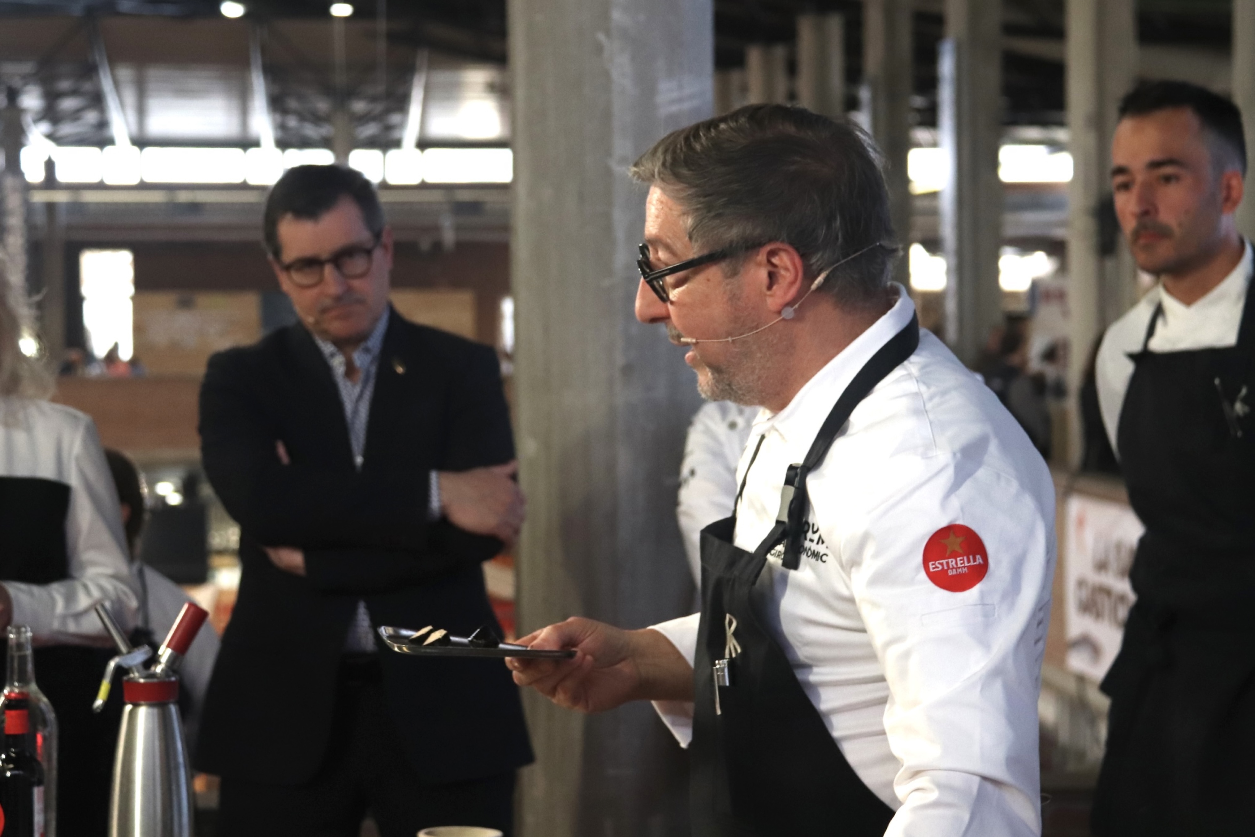 Chef Joan Roca shows the audience of the Girona Gastronomic Forum one of his latest dishes at Celler de Can Roca