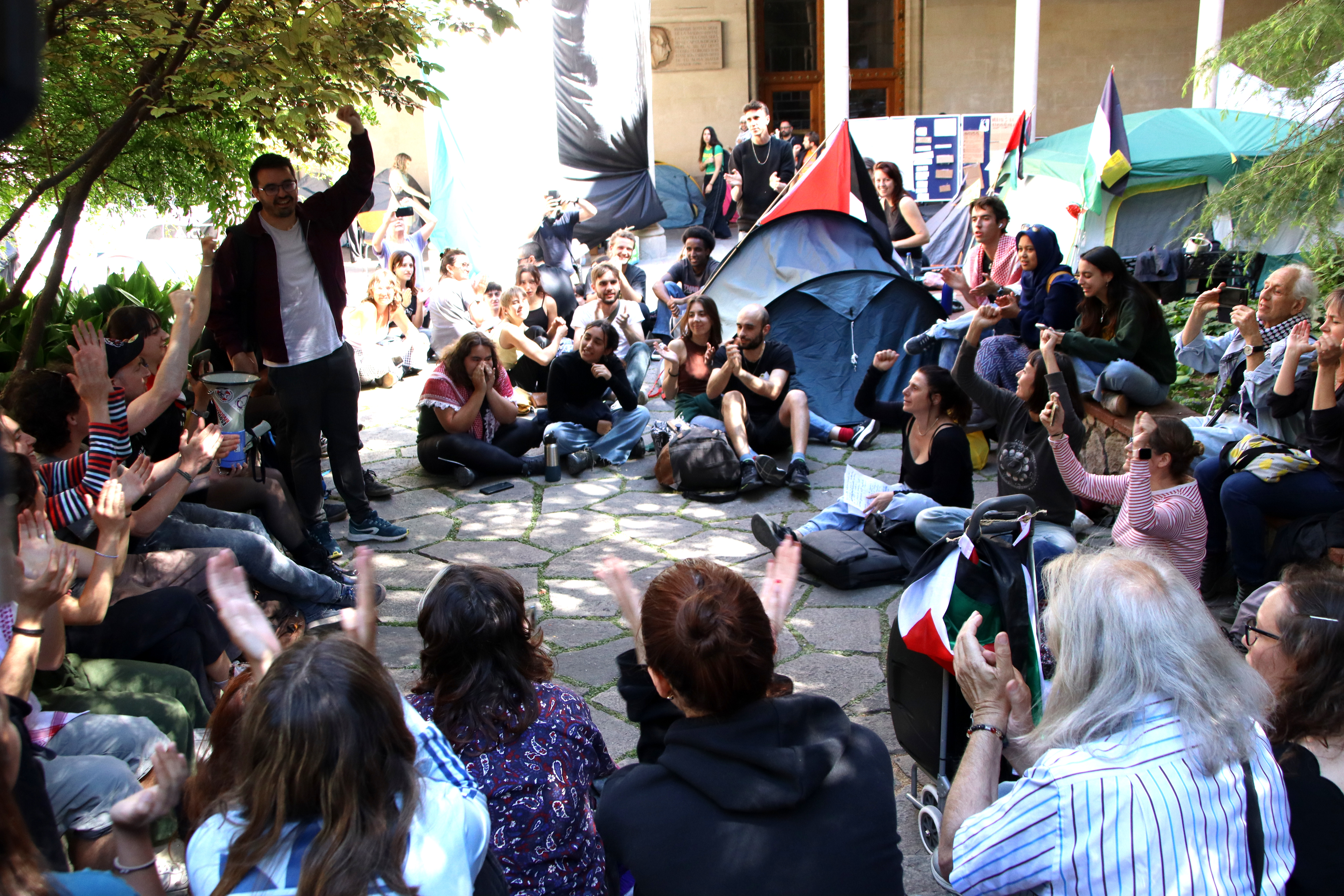 Protesters celebrate the result of the motion vote