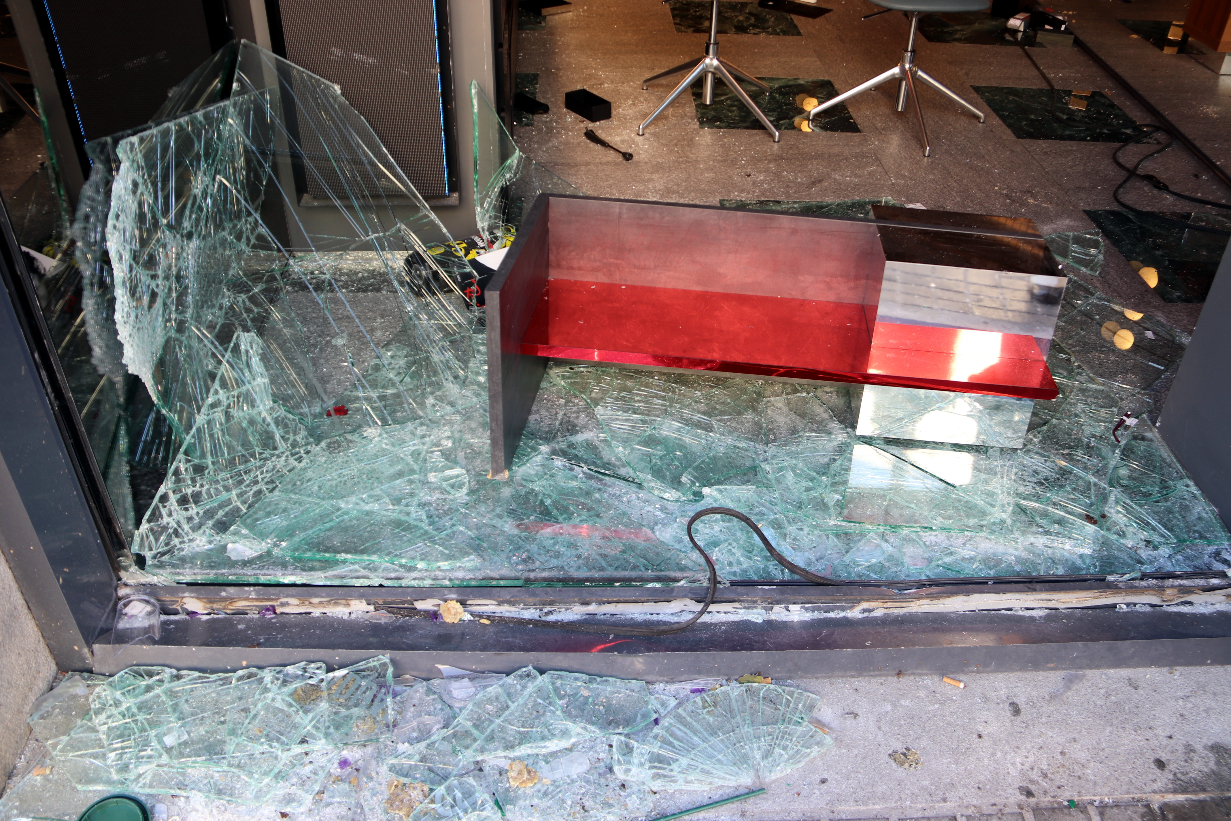 The display window of an optician's shop in the center of Barcelona, ??shattered during the unrest