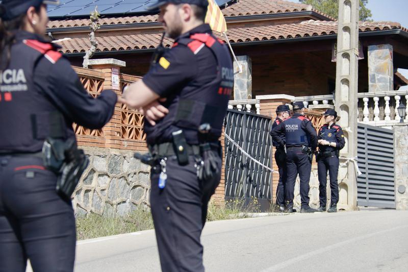 Mossos d'Esquadra officers at a home in Molins de Rei where two bodies were found