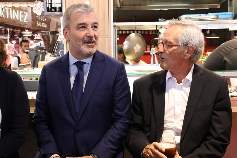 Socialist mayor candidate Jaume Collboni i Trias per Barcelona candidate Xavier Trias chat in a bar in the La Boqueria market on May 5, 2023