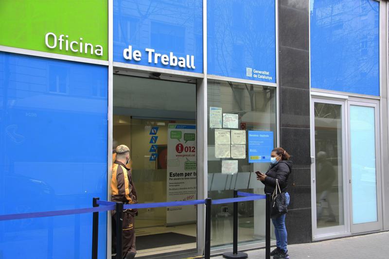 A woman outside an unemployment office in Barcelona