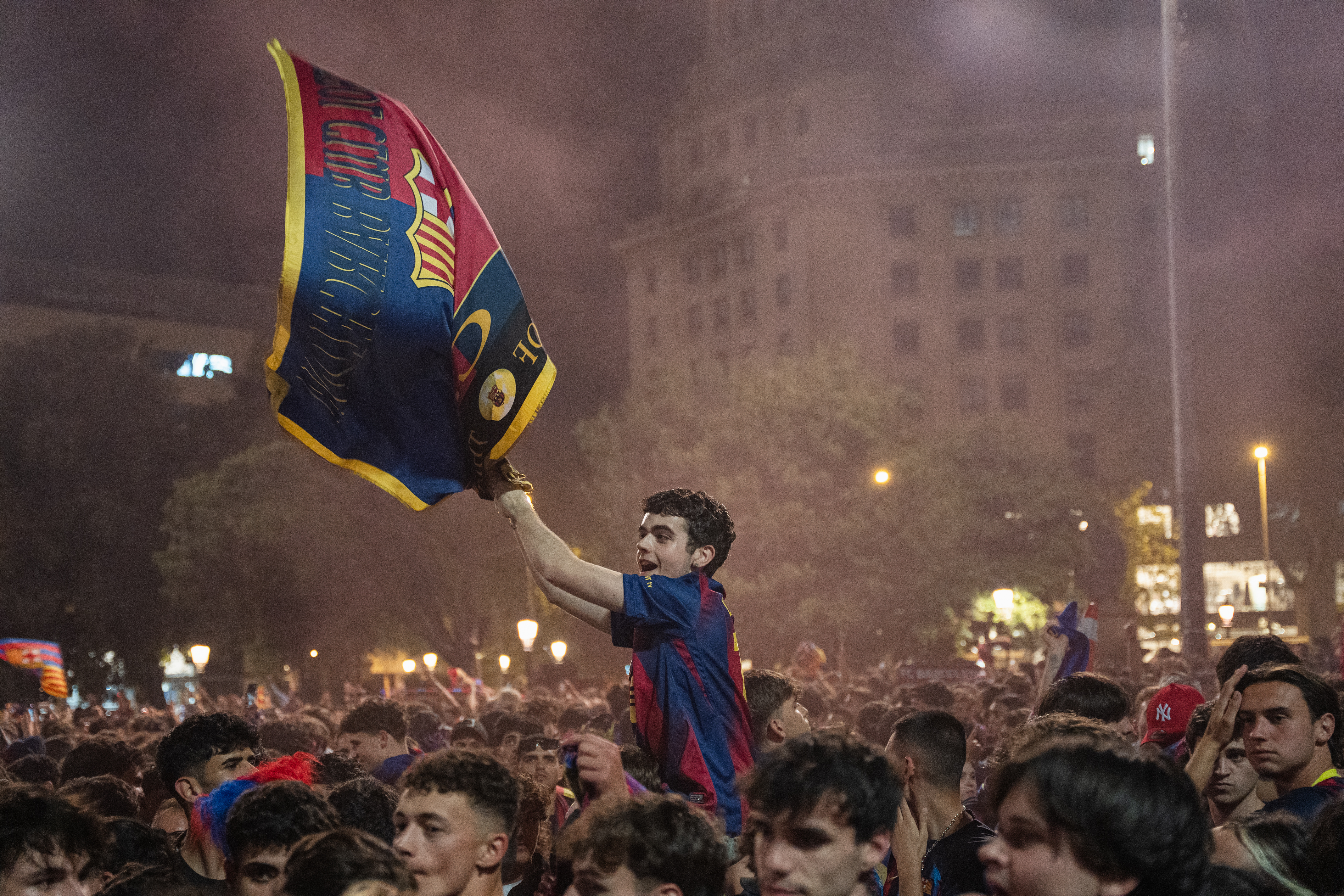 Barça fans celebrate the club’s 29th La Liga title at Plaça de Catalunya