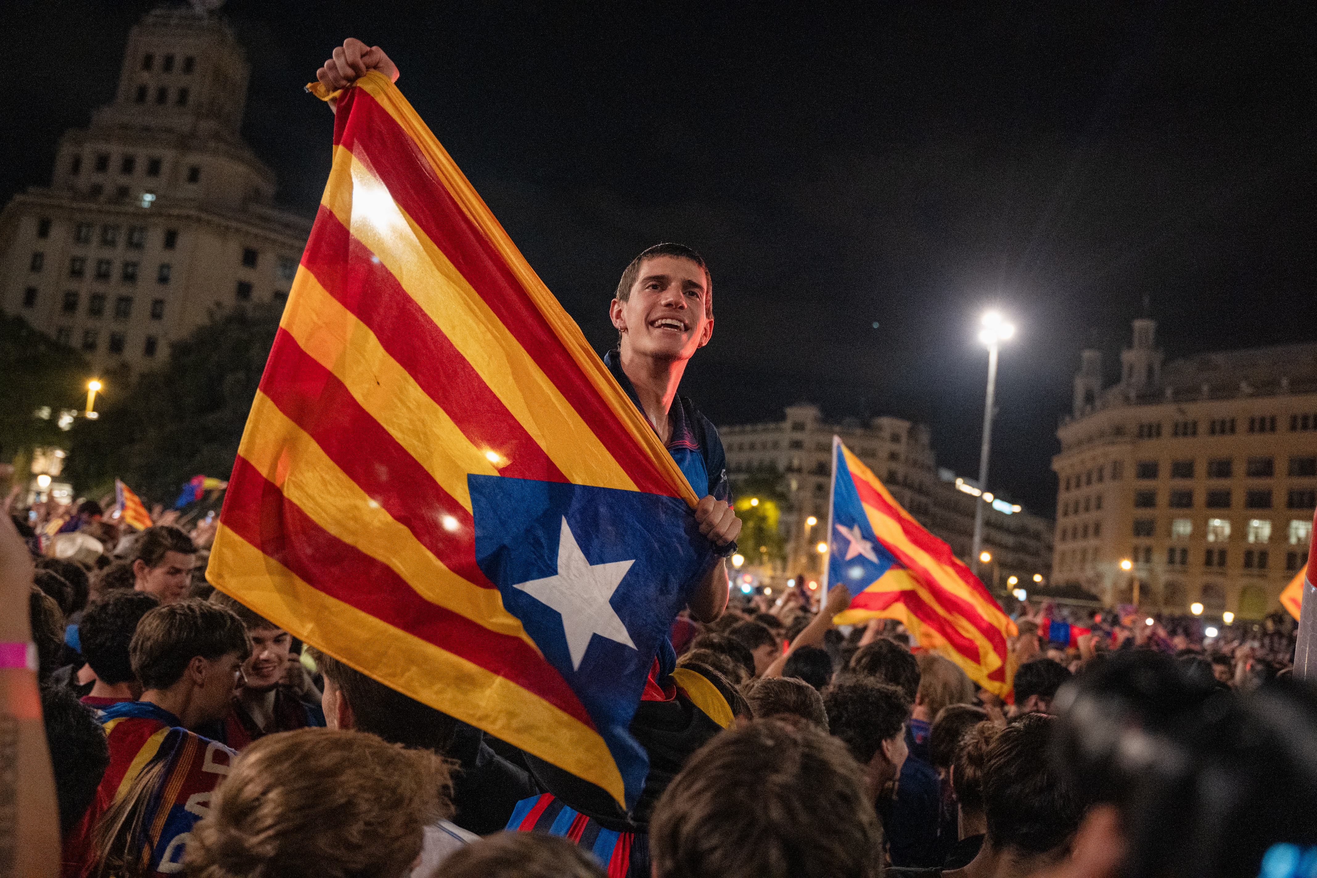Barça fans celebrate the club’s 29th La Liga title at Plaça de Catalunya