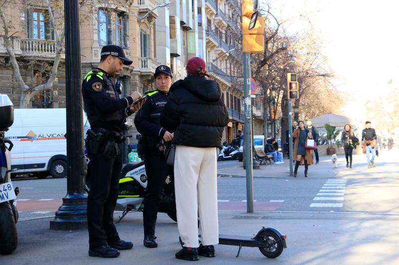 A Barcelona local police control on electric scooters in La Rambla de Catalunya boulevard