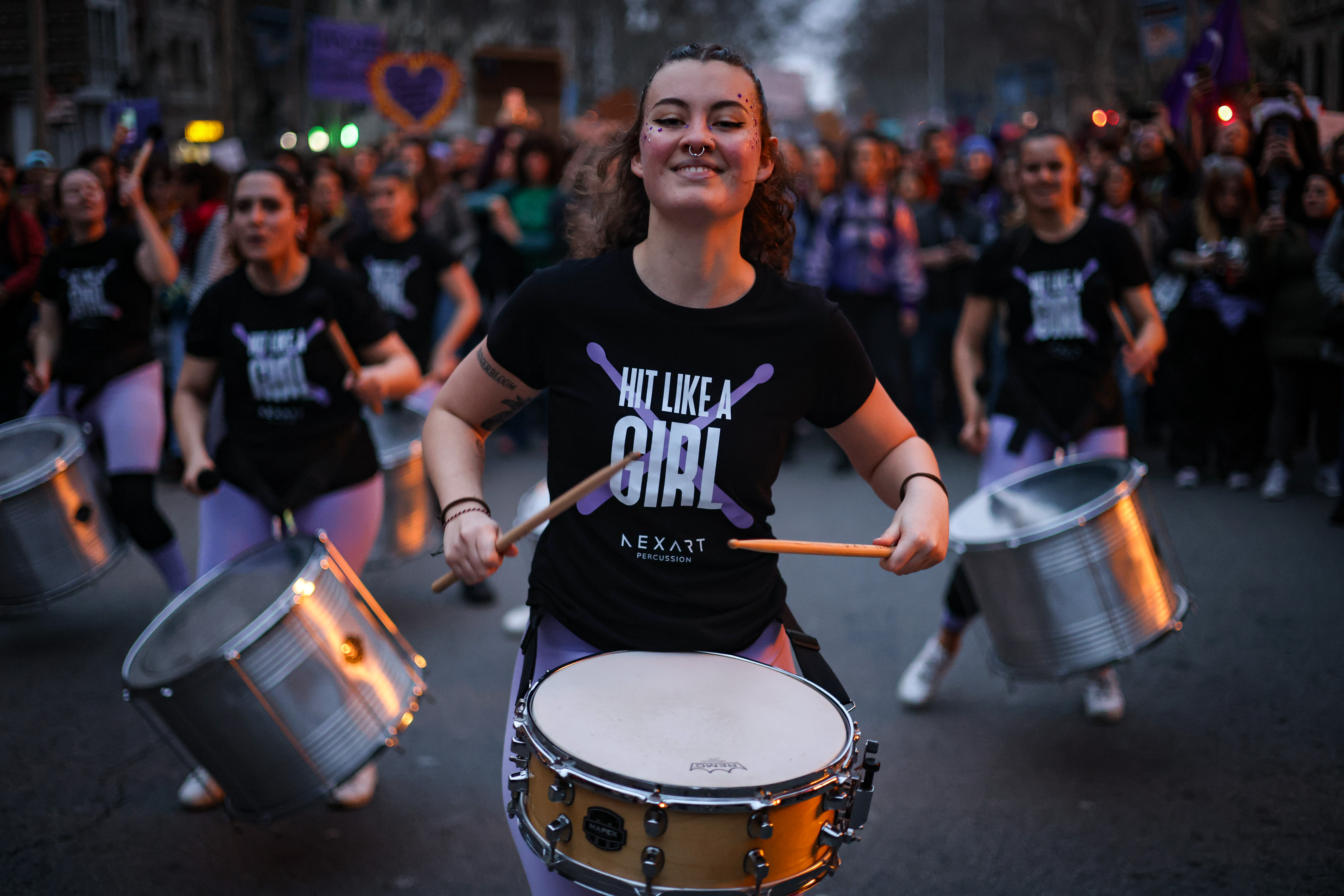 Several women playing drums during the 2025 International Women's Day march in Barcelona