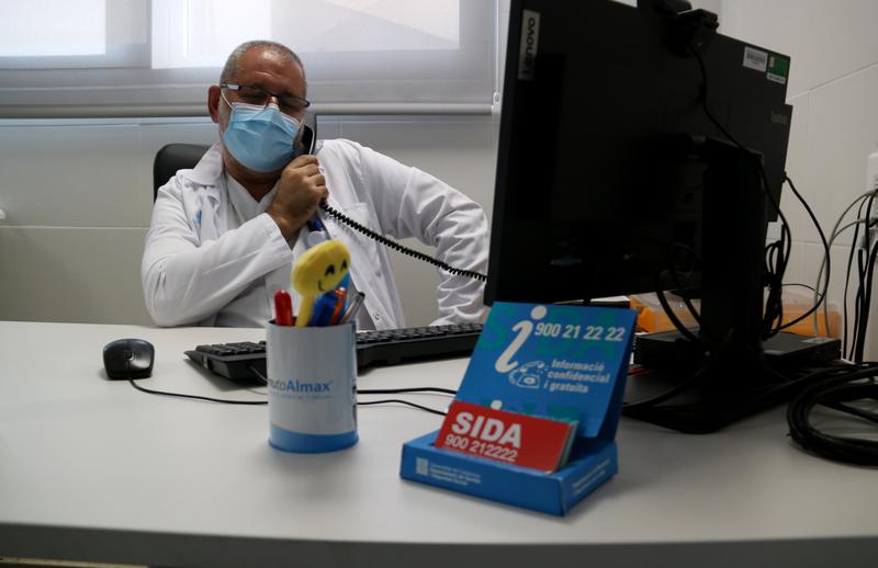 Doctor Amat Ortí speaks over the phone to a patient in the Hospital de Tortosa Verge de la Cinta hospital STDs department