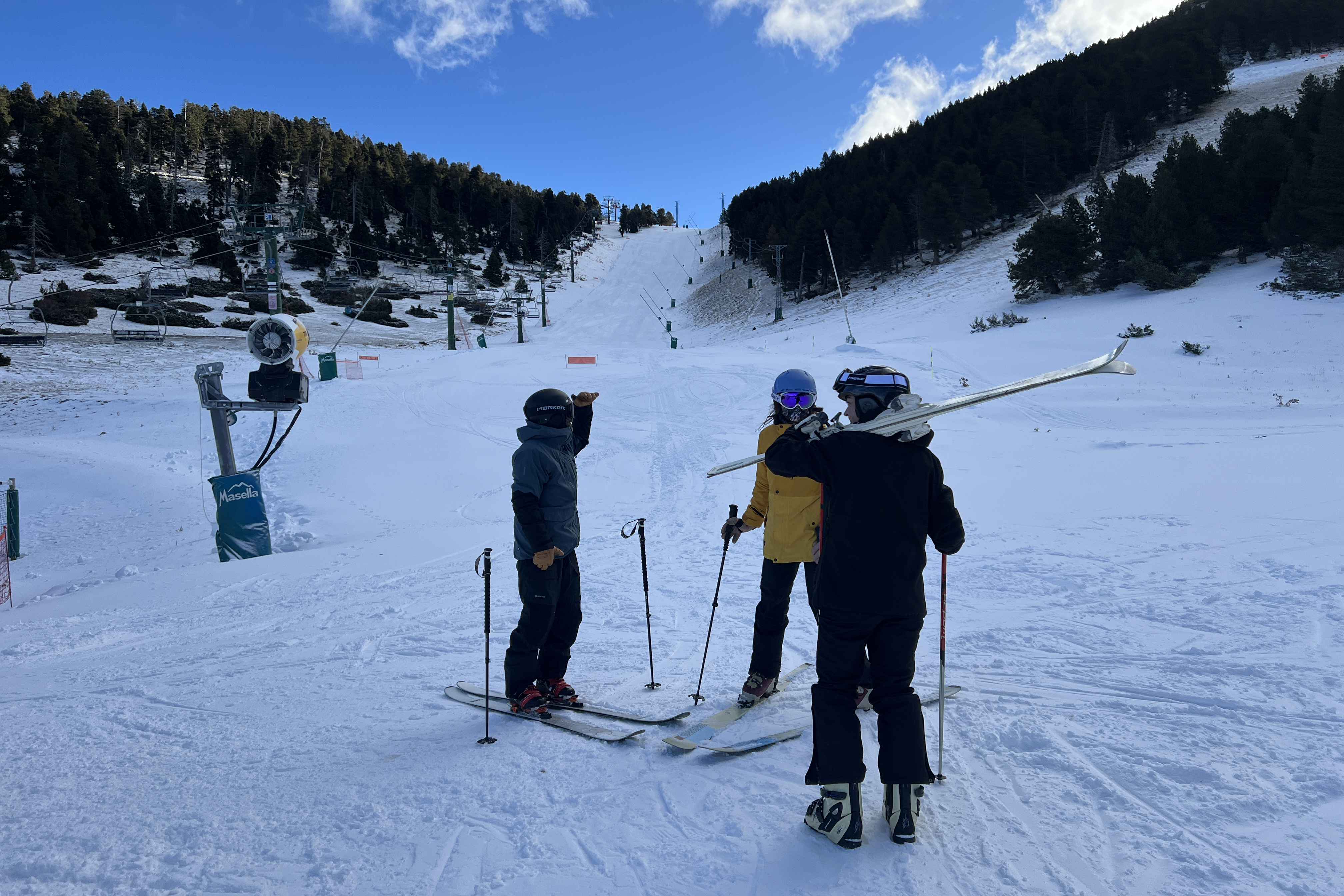 Three skiers on the first day of the new season