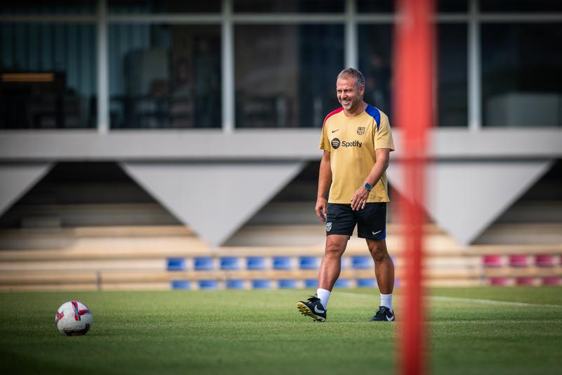 Barcelona men's first team manager Hansi Flick smiles during a team training session