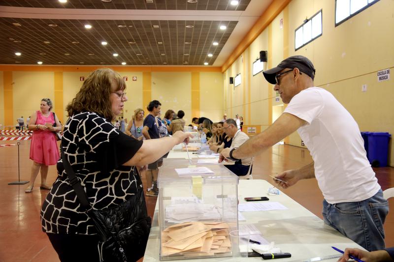 A voter casts their ballot in Mollerussa, western Catalonia