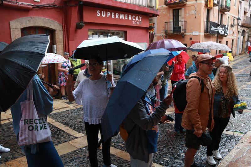 Locals in Tarragona take to the rainy streets for the Santa Tecla festival in the city in September