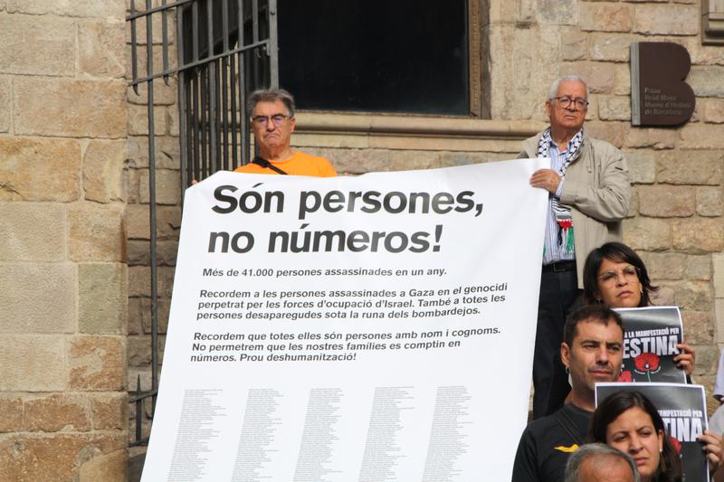 "They are people, not numbers!" banner by the Palestinian Community in Catalonia seen on a demonstration on October 3, 2024