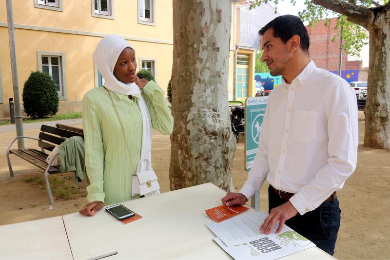 Gaissiry Sow, left, beside another member of the Coordinadora d'ONGs Solidàries, campaigning to extend the right to vote
