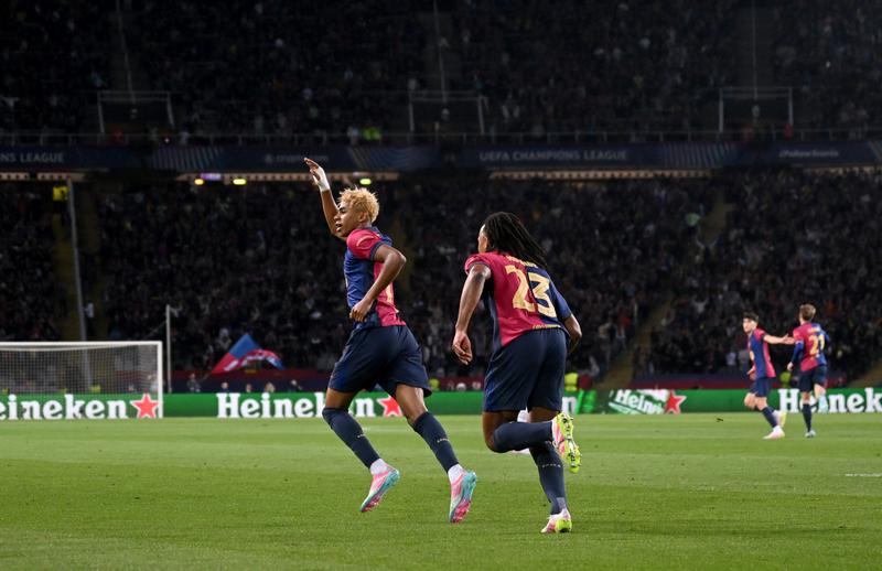 Lamine Yamal of FC Barcelona celebrates scoring his team's first goal with teammate Jules Kounde