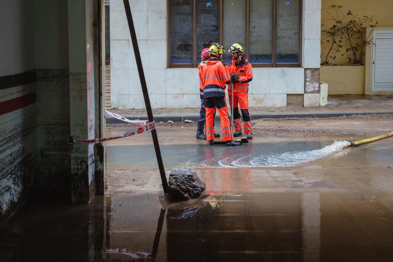Firefighters work in Santa Bàrbara, in the south of Catalonia, after heavy rain