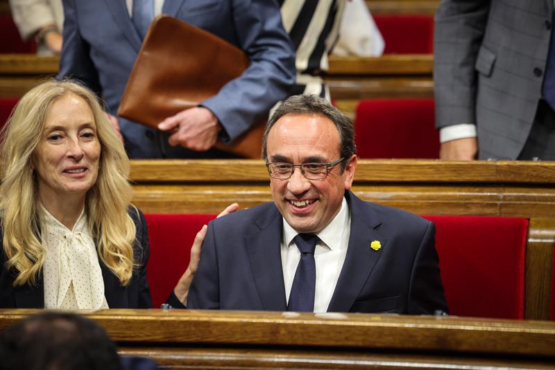 Former Catalan minister and pardoned pro-independence leader Josep Rull smiling in the Catalan parliament on June 10, 2024