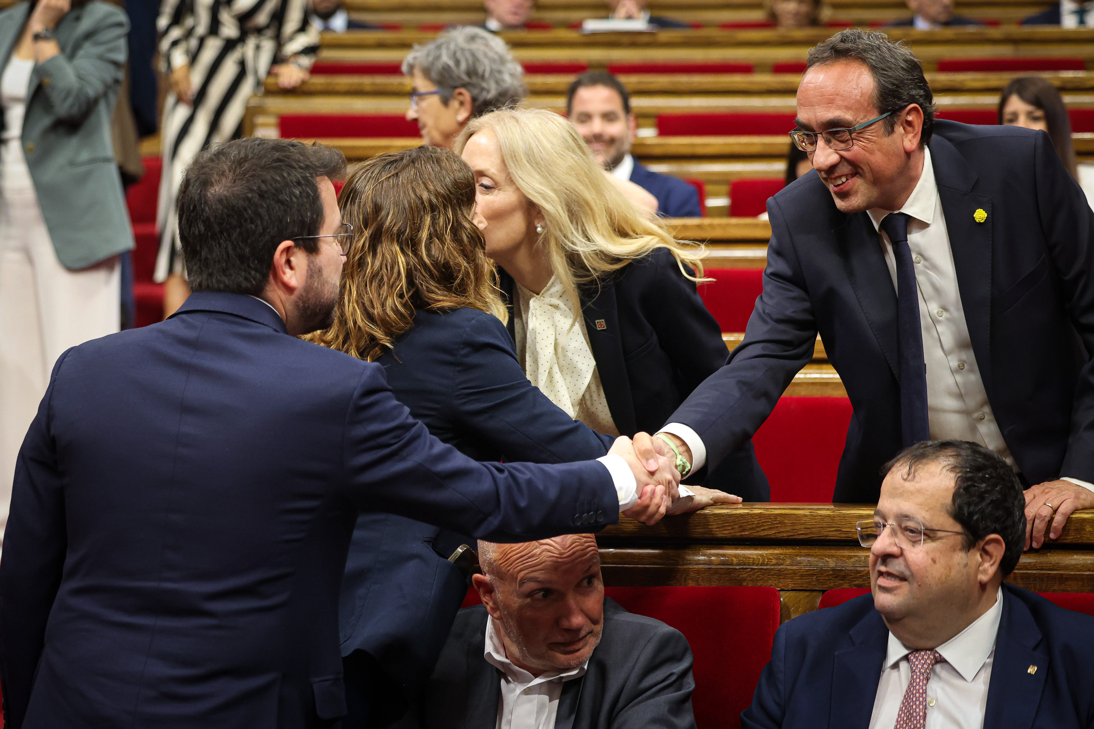 Acting Catalan president Pere Aragonès greets Junts+ spokesperson Josep Rull ahead of the first parliamentary session on June 10, 2024