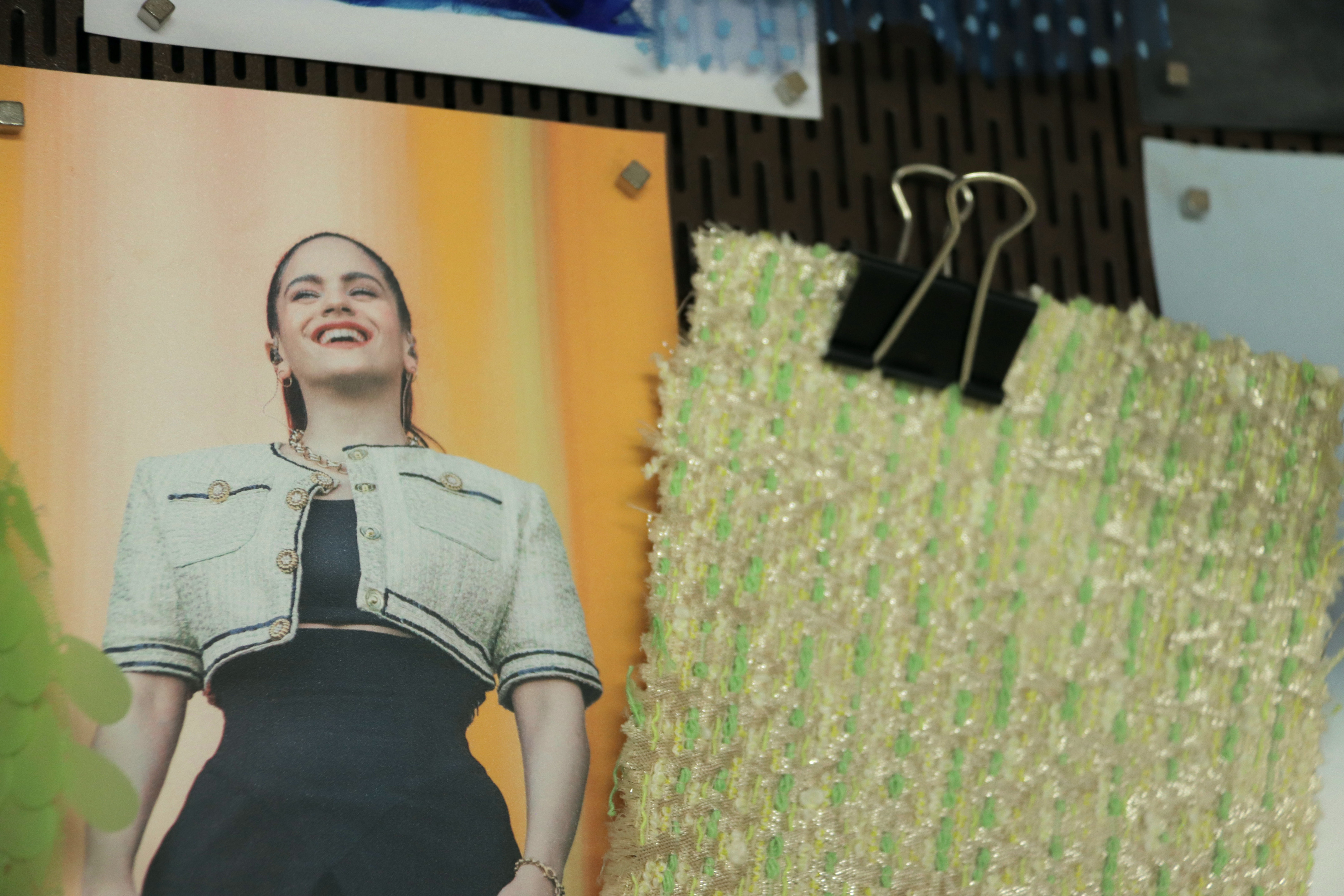 A photo of Catalan singer Rosalía hangs at Gratacós' showroom in Barcelona next to a piece of the fabric she wore on stage