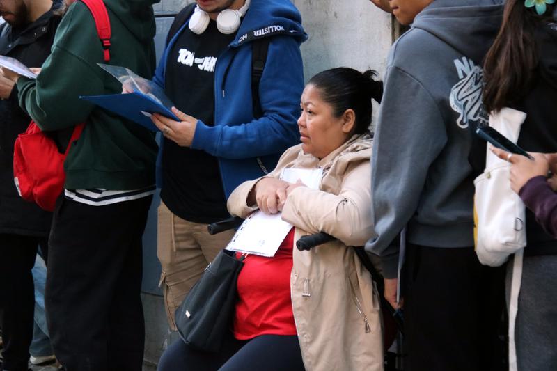A woman queues outside Barcelona's OAC Monumental office during Spain’s migrant regularisation programme