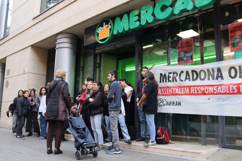 Activists blocking the entrance of the supermarket