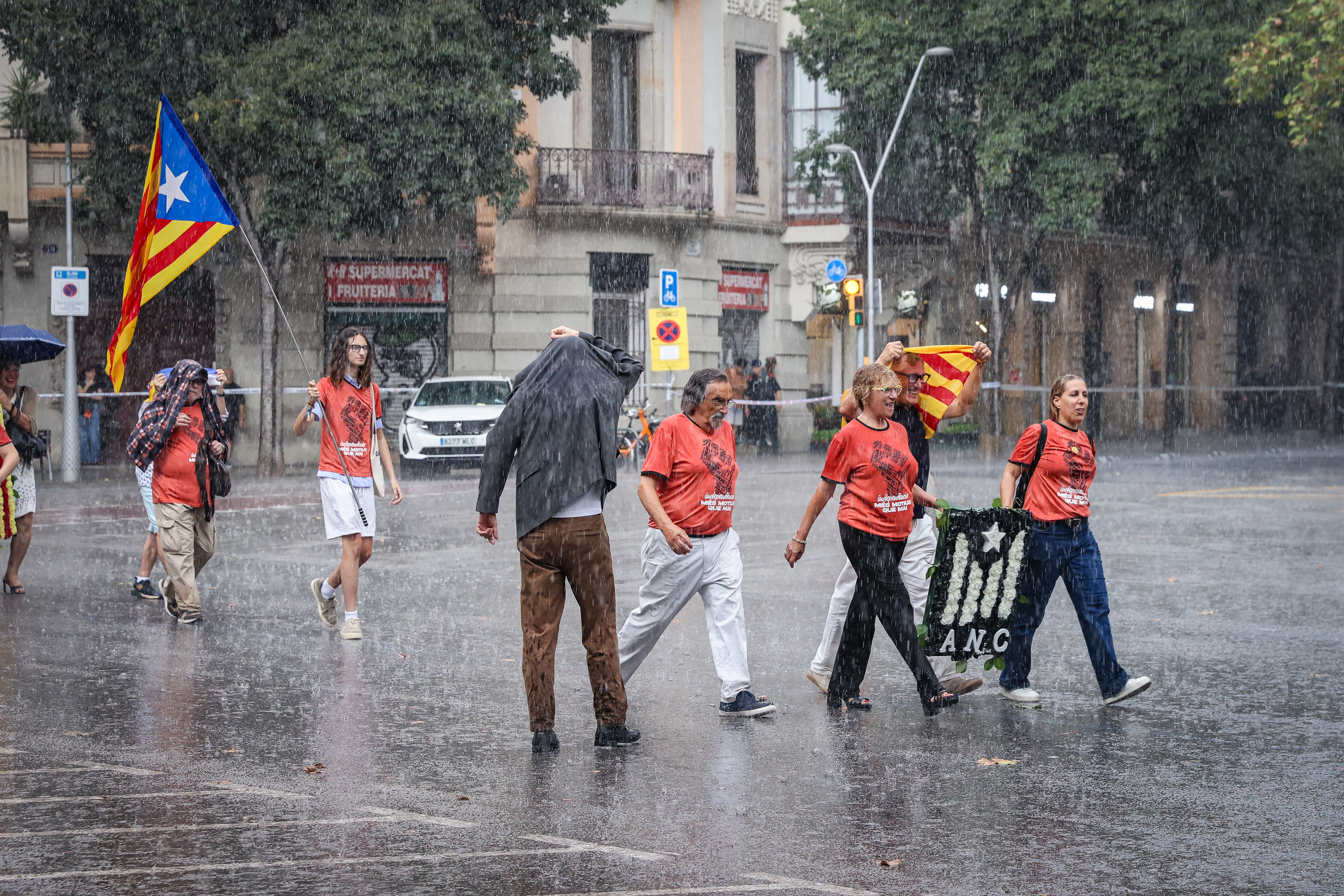 The floral tributes were interrupted by the rain