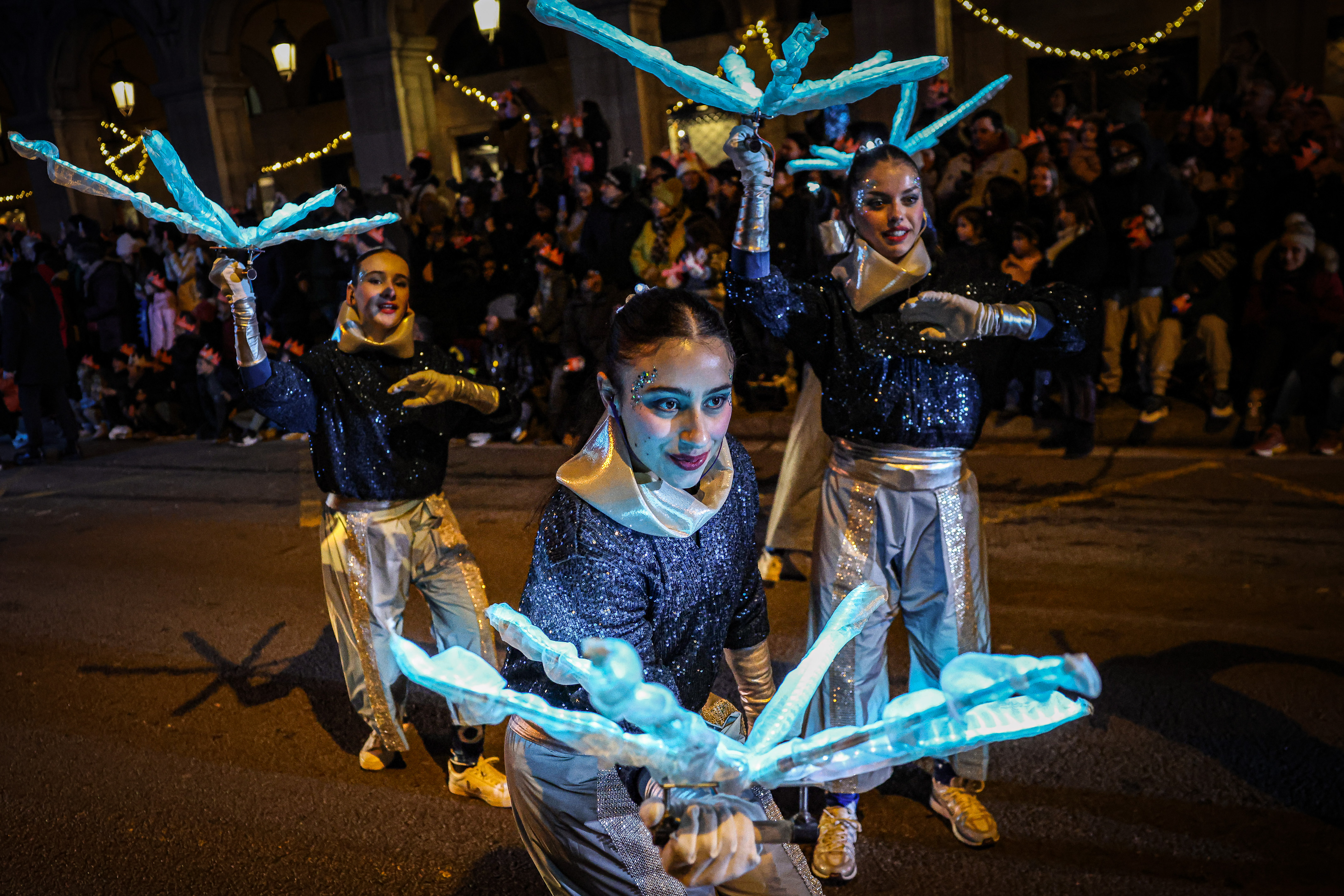 A group of dancers performs a choreographed routine during La Cavalcada in Barcelona.