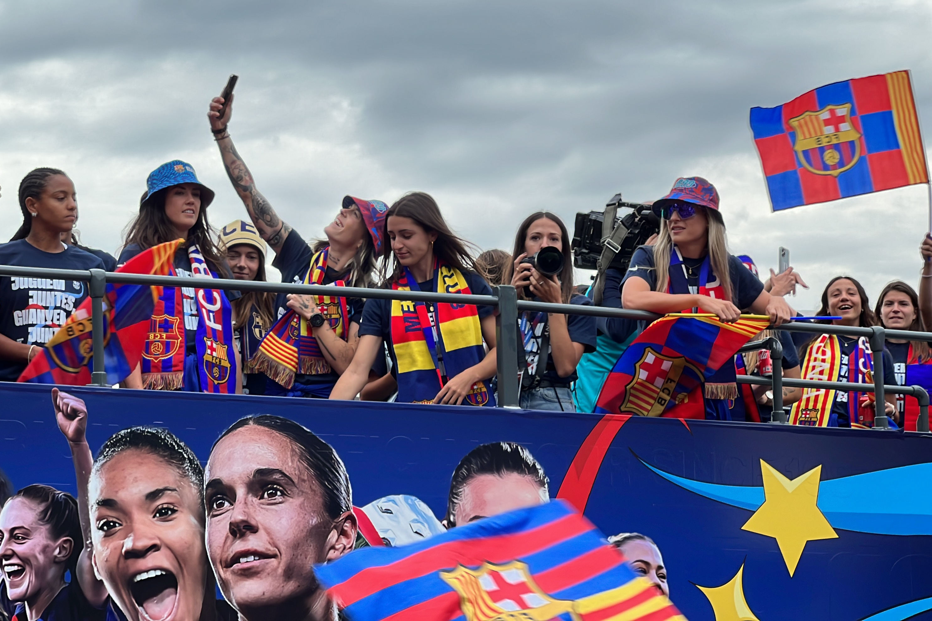 Barça women's team on an open top bus for the victory parade