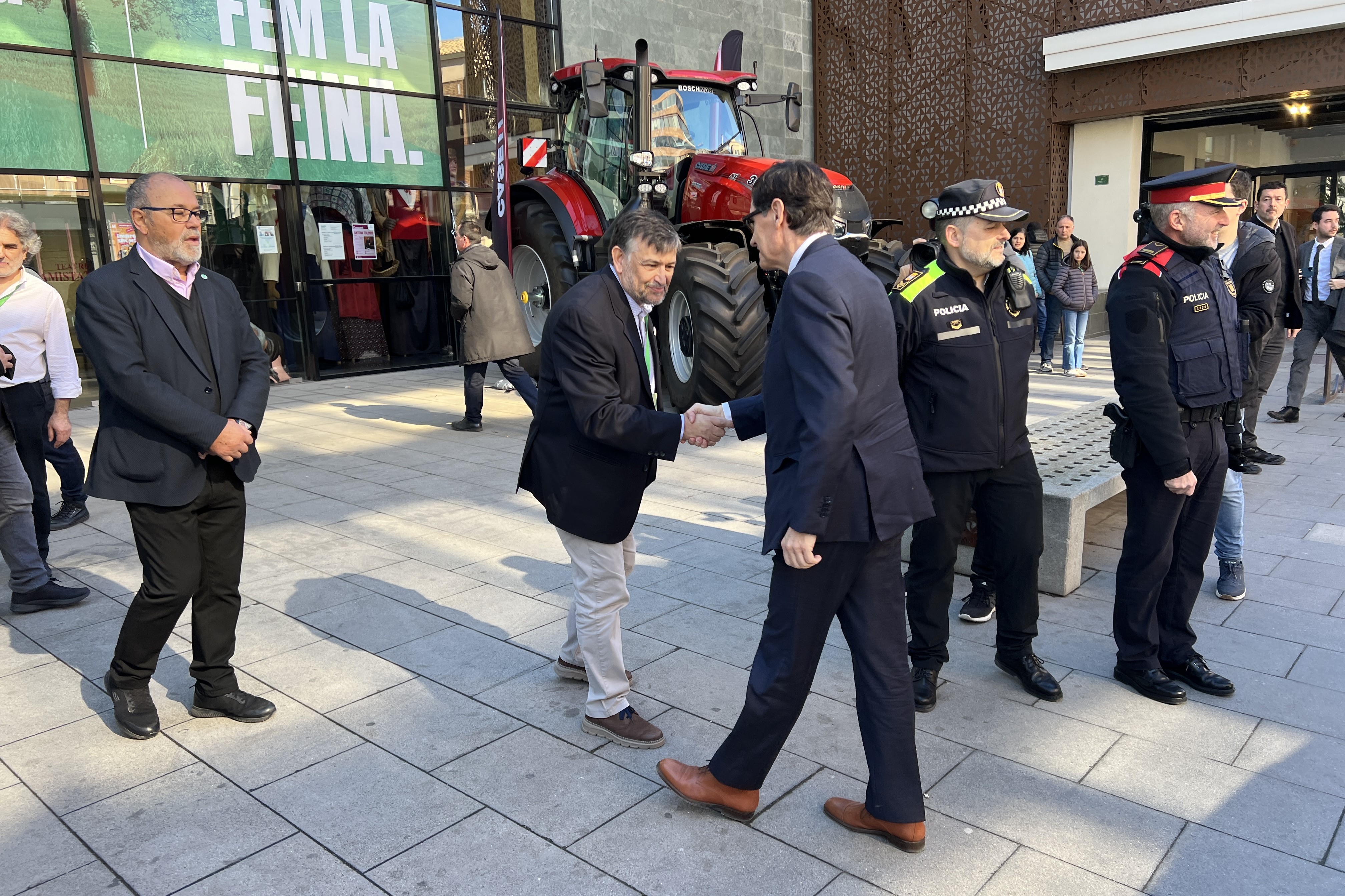 Catalan president Salvador Illa greets Joan Cabal, Farmer's Union national coordinator, in Mollerussa during the union's congress on February 9, 2025