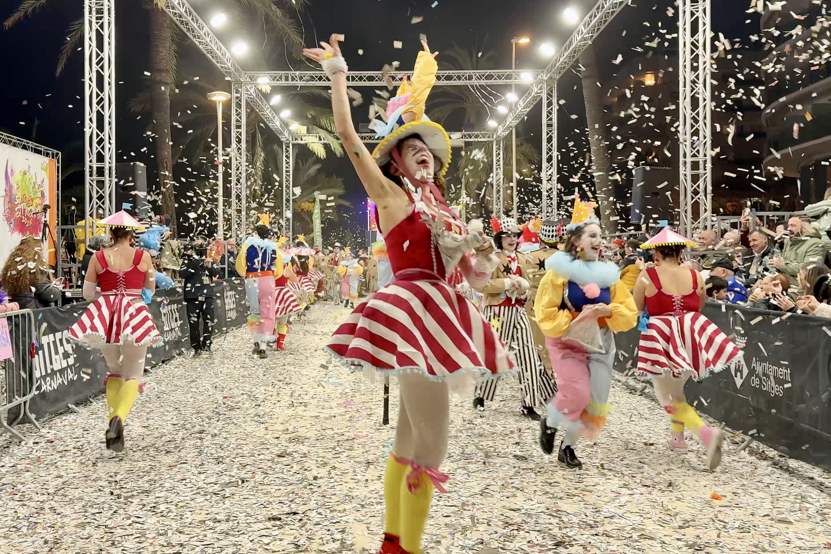 Participants and spectators alike were covered in colorful confetti by the carnival clowns