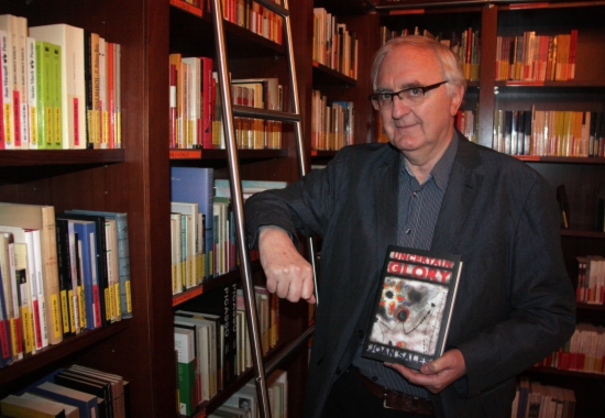 Peter Bush poses with a copy of the English translation of Uncertain Glory